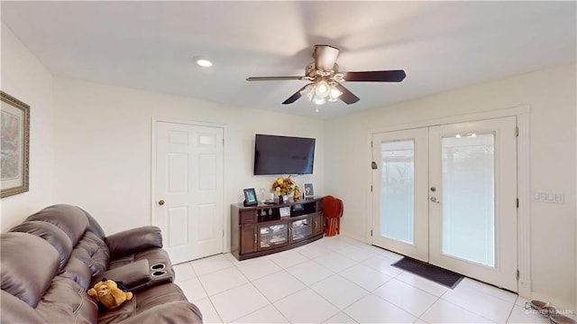 living room with french doors, light tile patterned flooring, and ceiling fan