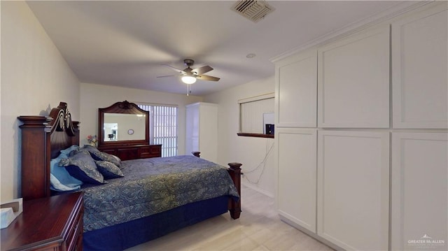 bedroom featuring ceiling fan and visible vents