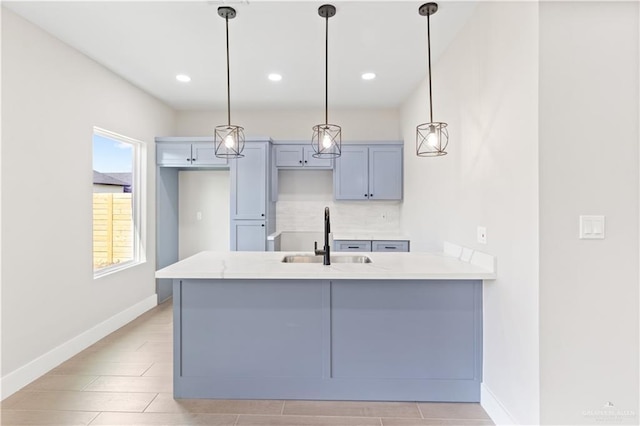 3925 S Mullin Ave, Edinburg, TX 78542 - kitchen featuring a peninsula, tasteful backsplash, hanging light fixtures, and recessed lighting
