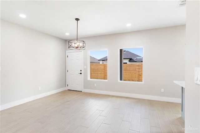 3925 S Mullin Ave, Edinburg, TX 78542 - unfurnished dining area with light wood-type flooring, recessed lighting, and a chandelier