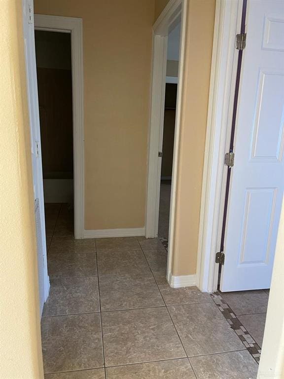 corridor with tile patterned floors