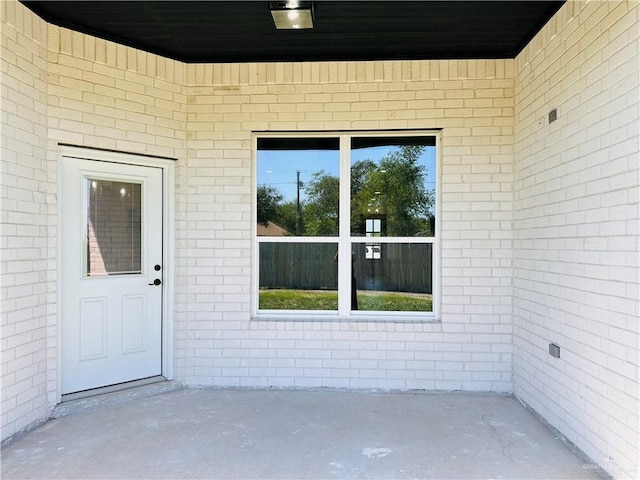 2201 Blue Sky Dr, Weslaco, TX 78599 - entrance to property with brick siding and a patio