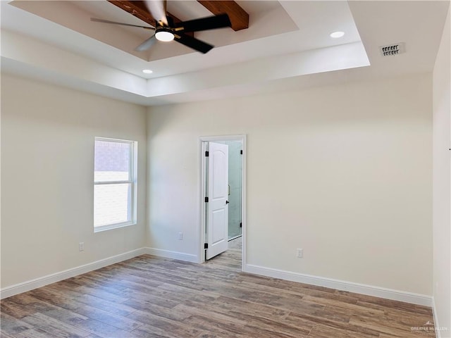 2201 Blue Sky Dr, Weslaco, TX 78599 - empty room with a raised ceiling, recessed lighting, wood finished floors, baseboards, and a ceiling fan