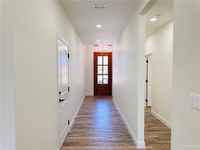 2201 Blue Sky Dr, Weslaco, TX 78599 - doorway to outside with wood finished floors, baseboards, and recessed lighting