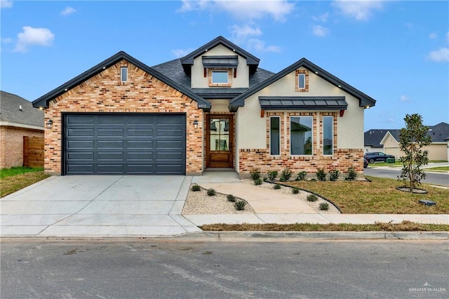 view of front of home with concrete driveway, metal roof, an attached garage, a standing seam roof, and brick siding