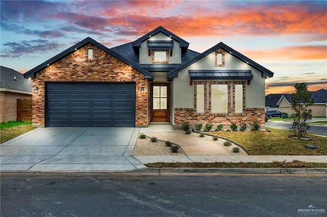 view of front facade featuring driveway, metal roof, an attached garage, a standing seam roof, and brick siding