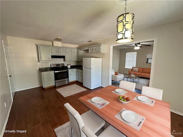 8802 N 29th Ln, Mcallen, TX 78504 - dining room featuring dark wood-style flooring and a ceiling fan