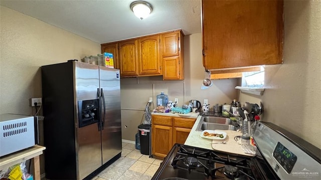 kitchen with sink and appliances with stainless steel finishes