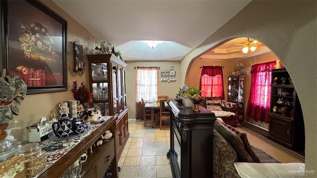 dining room featuring a skylight, ceiling fan, and ornamental molding