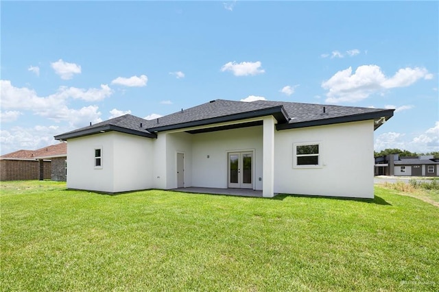 3721 Diamondhead Ave, Alton, TX 78573 - back of house with french doors, a yard, and stucco siding