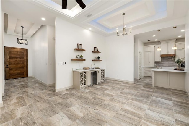 3721 Diamondhead Ave, Alton, TX 78573 - kitchen with a tray ceiling, a chandelier, light countertops, ceiling fan, and recessed lighting