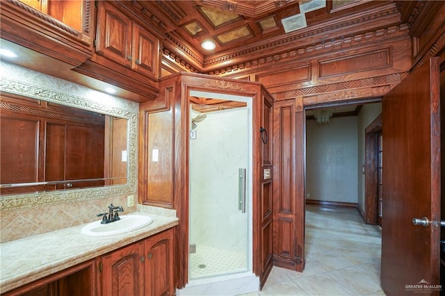 bathroom featuring tasteful backsplash, vanity, and a shower with shower door