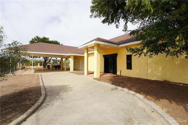 view of front of house with a carport