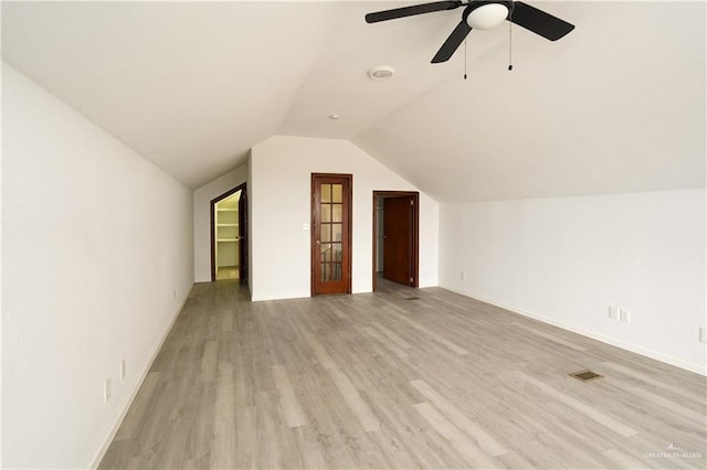 bonus room featuring ceiling fan, lofted ceiling, and light hardwood / wood-style flooring