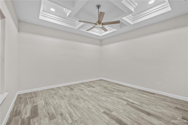 spare room featuring baseboards, a ceiling fan, coffered ceiling, and wood finished floors