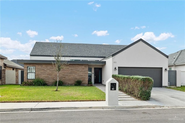 view of front of home featuring a garage and a front yard