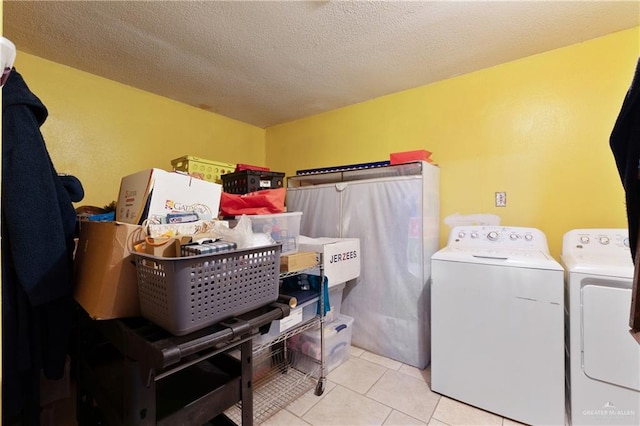 217 Carolina Ave, Mission, TX 78572 - clothes washing area with washing machine and dryer, light tile patterned floors, and a textured ceiling