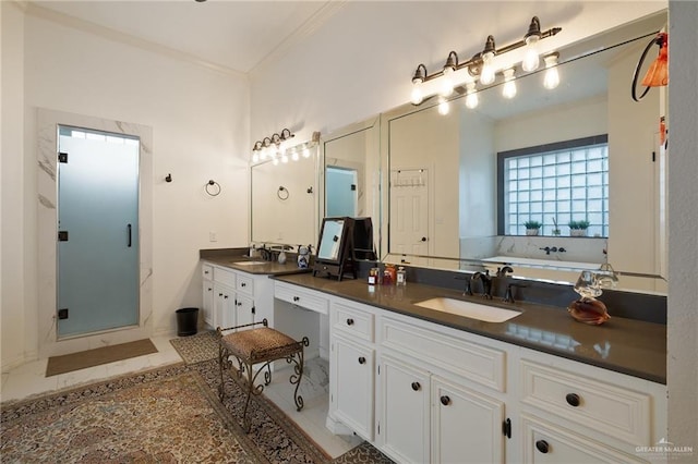 408 E Newport Ln, Mcallen, TX 78501 - full bath featuring ornamental molding, double vanity, a stall shower, a bath, and tile patterned floors