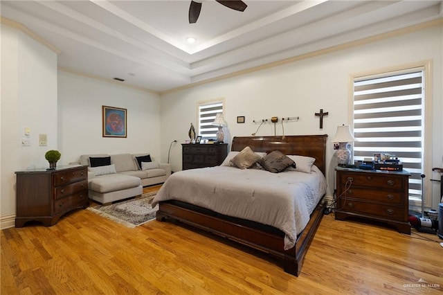 408 E Newport Ln, Mcallen, TX 78501 - bedroom featuring light wood-style floors, crown molding, ceiling fan, and a tray ceiling
