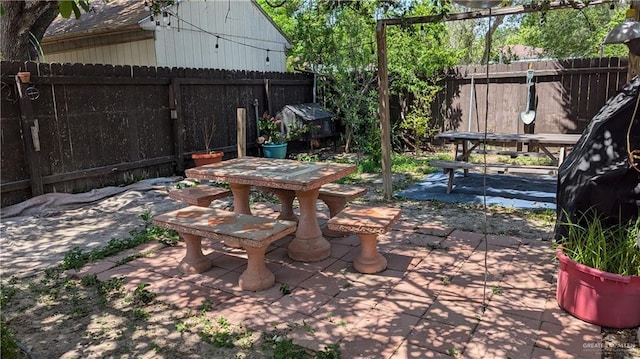 2104 Harvey St, Mcallen, TX 78501 - view of patio with outdoor dining space and a fenced backyard