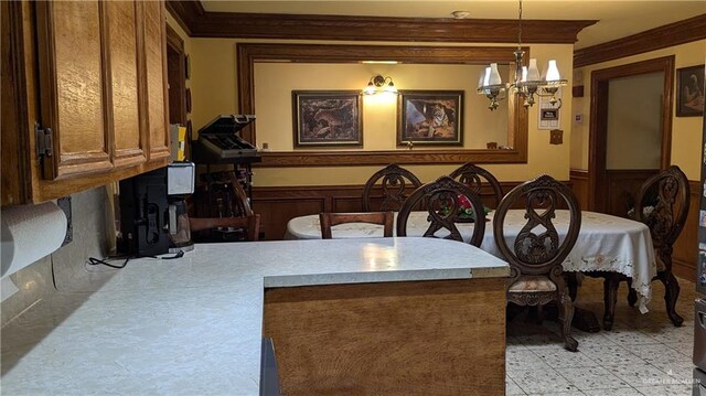 2104 Harvey St, Mcallen, TX 78501 - dining area featuring an inviting chandelier, ornamental molding, wainscoting, and light floors