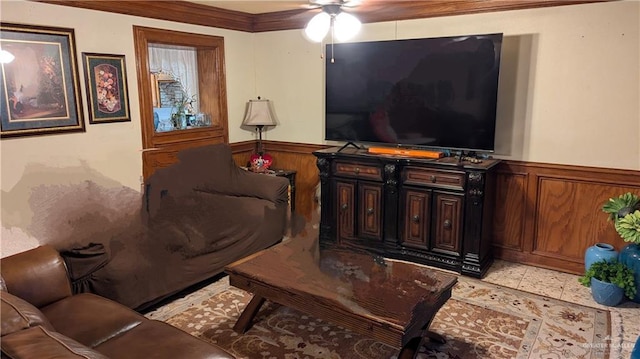 2104 Harvey St, Mcallen, TX 78501 - living room with crown molding, ceiling fan, and a wainscoted wall
