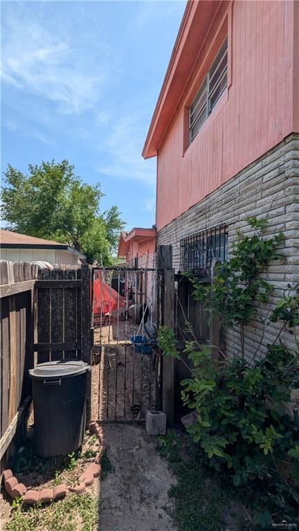 2104 Harvey St, Mcallen, TX 78501 - view of home's exterior featuring fence and stone siding