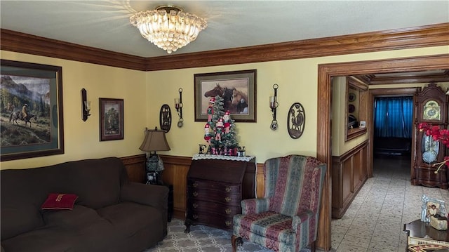 2104 Harvey St, Mcallen, TX 78501 - living area with ornamental molding, wainscoting, and a chandelier