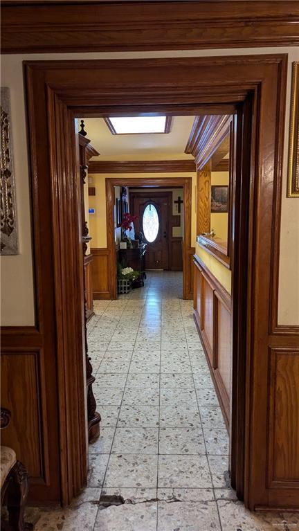 2104 Harvey St, Mcallen, TX 78501 - hall with a wainscoted wall and wood walls