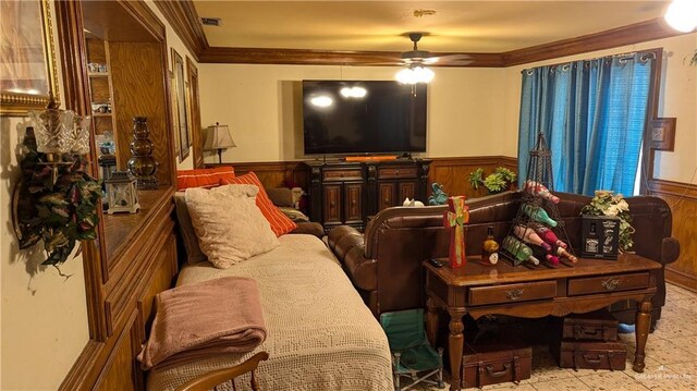 2104 Harvey St, Mcallen, TX 78501 - living room featuring wooden walls, a wainscoted wall, crown molding, and a ceiling fan