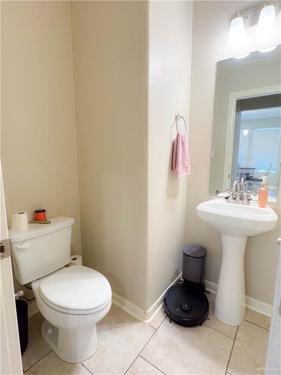 bathroom featuring toilet and tile patterned floors