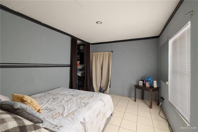 18315 Washington Palm Dr, Penitas, TX 78576 - bedroom featuring light tile patterned floors and ornamental molding