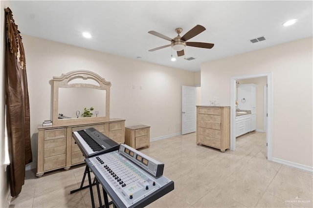 exercise room with ceiling fan