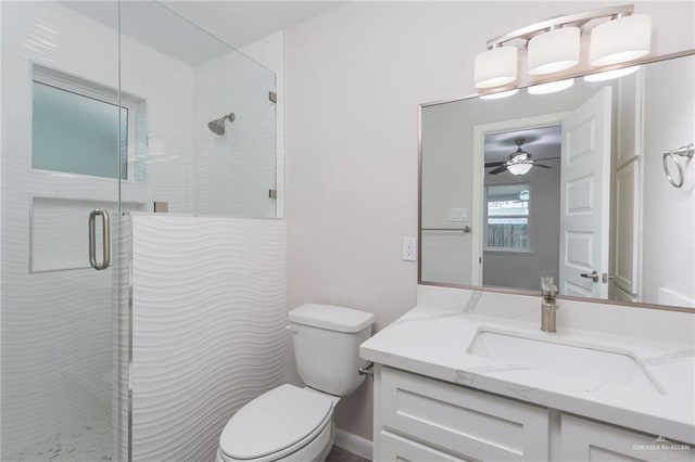 bathroom with vanity, an enclosed shower, and toilet