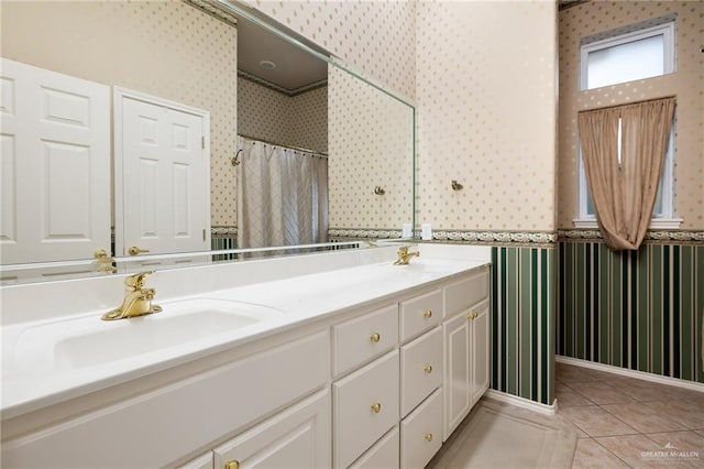 bathroom featuring vanity, tile patterned floors, and walk in shower