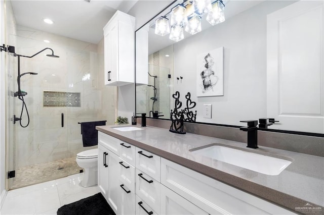 2215 Corales St, Mission, TX 78573 - bathroom featuring a shower stall, marble look tile flooring, double vanity, and recessed lighting