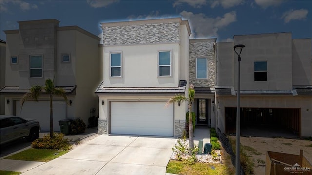 2215 Corales St, Mission, TX 78573 - view of property featuring stone siding, a garage, stucco siding, and driveway