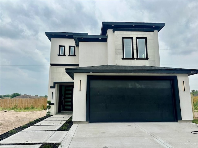 2602 E Solar Dr, Mission, TX 78574 - contemporary home featuring an attached garage, concrete driveway, and stucco siding