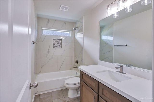 full bathroom with tile patterned flooring, vanity, toilet, and tiled shower / bath