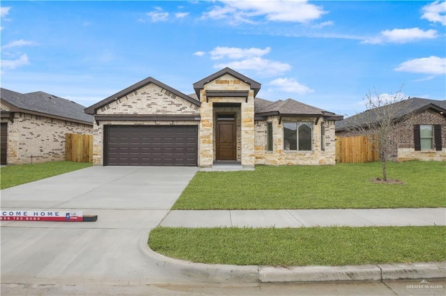 view of front facade featuring a front yard and a garage