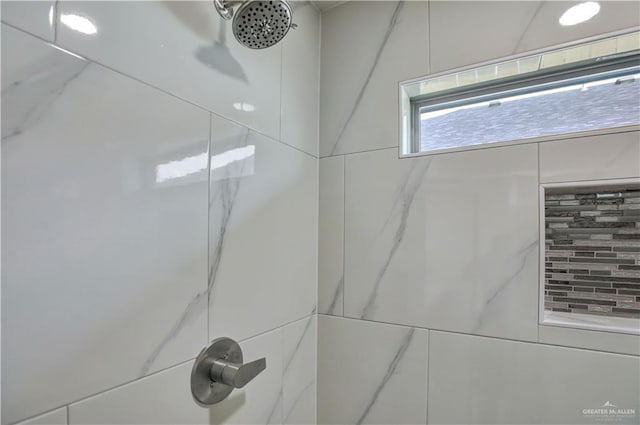 details with a tile shower