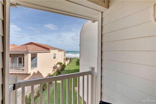 balcony with a view of the beach and a water view