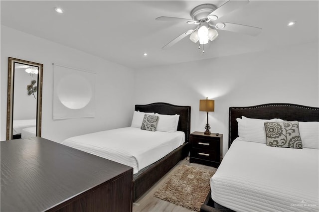 bedroom featuring ceiling fan, light wood-style flooring, and recessed lighting