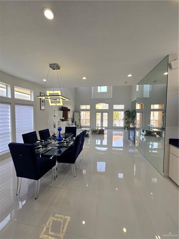 6503 Fountain Way S, Padre Island, TX 78597 - dining room featuring light tile patterned flooring and recessed lighting