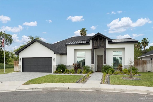 contemporary house with a front lawn and a garage