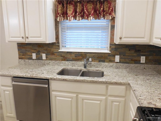 502 Castillos Y Diamantes St, Mission, TX 78572 - kitchen featuring stainless steel dishwasher, a sink, white cabinets, backsplash, and light stone counters