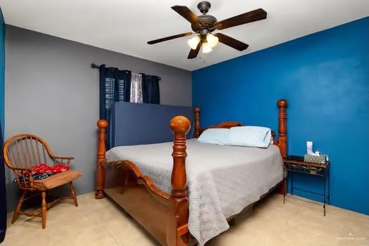 bedroom featuring ceiling fan and light carpet