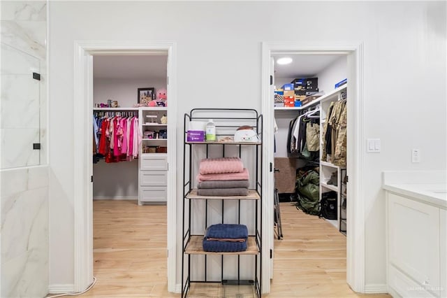 1801 Stardust Ln, Edinburg, TX 78541 - walk in closet with light wood-style flooring