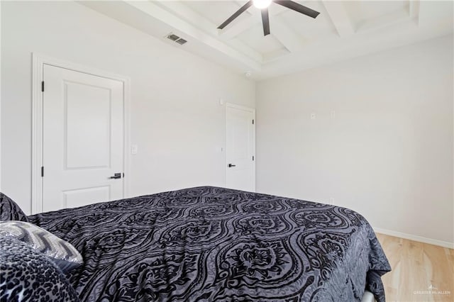 1801 Stardust Ln, Edinburg, TX 78541 - bedroom with beamed ceiling, light wood-type flooring, ceiling fan, and coffered ceiling