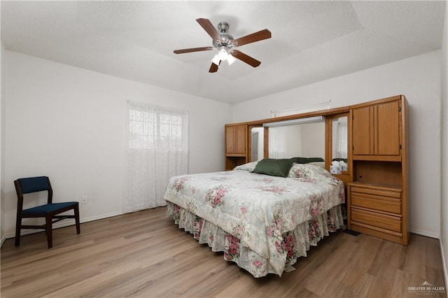 406 Sagittarius St, Mission, TX 78572 - bedroom featuring light wood finished floors, baseboards, and a ceiling fan